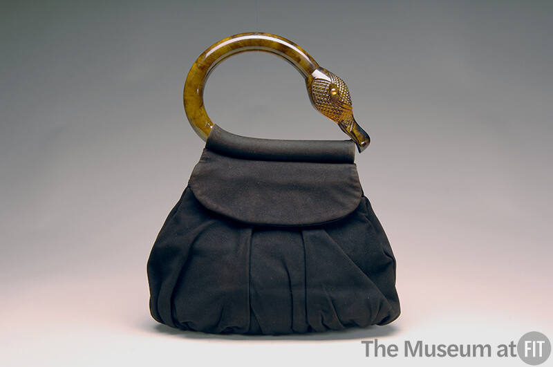 Dark brown suede pouch handbag with tortoise shell flamingo head and neck shaped handle