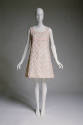 White sleeveless A-line shift mini dress with pink satin overlay of daisies and paillette cente…
