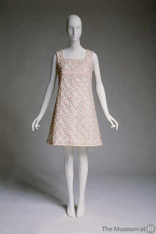 White sleeveless A-line shift mini dress with pink satin overlay of daisies and paillette cente…