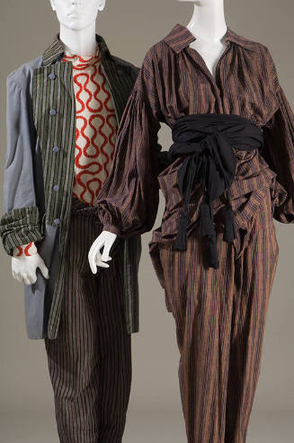 Left: Grey, green, black striped jacket, orange and white squiggle design top, grey, black and …