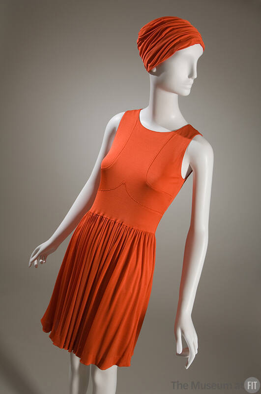 Orange sleeveless mini dress with gathered skirt and matching turban