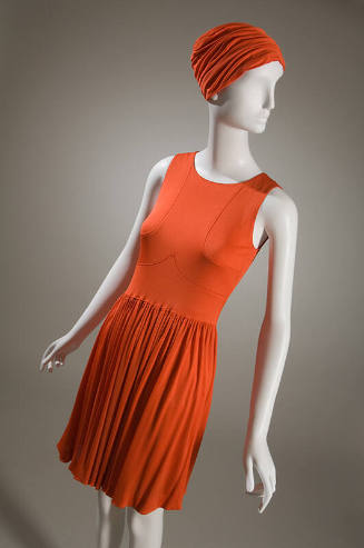 Orange sleeveless mini dress with gathered skirt and matching turban