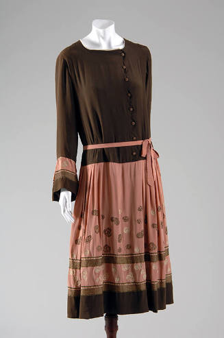 Dress with brown bodice and rose pink trim on long sleeves and rose pink skirt with brown and g…