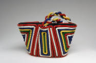 Small tote bag with red, white, blue, yellow, and green coiled telephone cord in symmetrical ge…