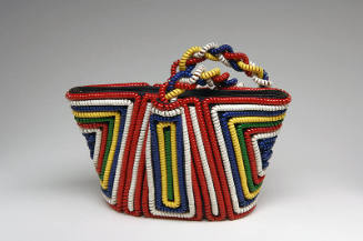 Small tote bag with red, white, blue, yellow, and green coiled telephone cord in symmetrical ge…