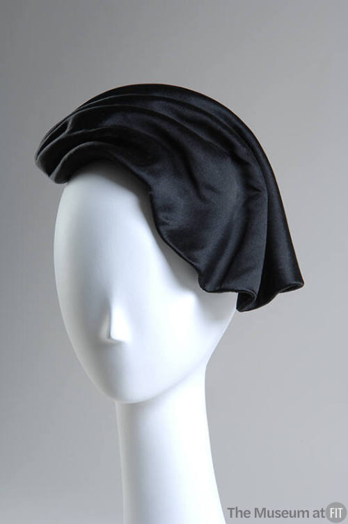 Black asymmetrical wave shaped hat