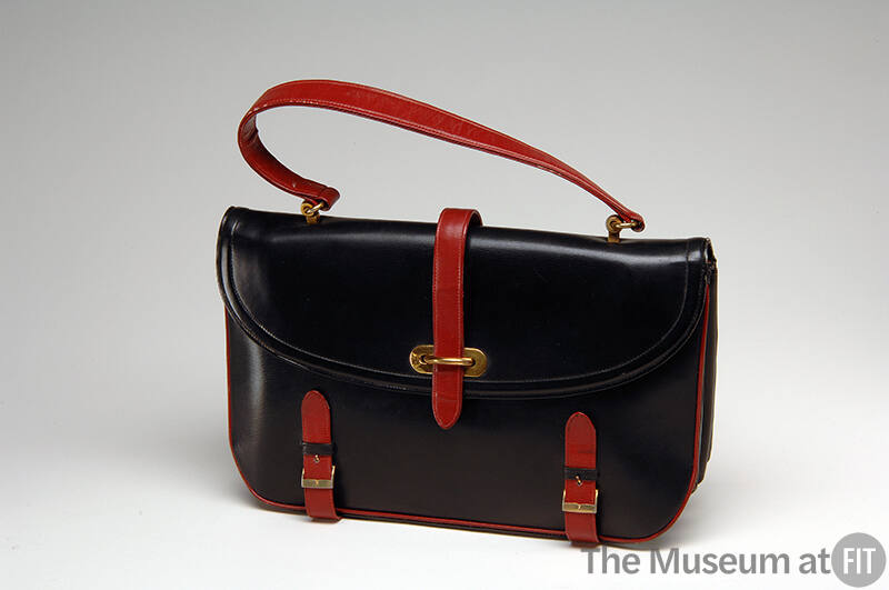 Black satchel style handbag with red handle and straps