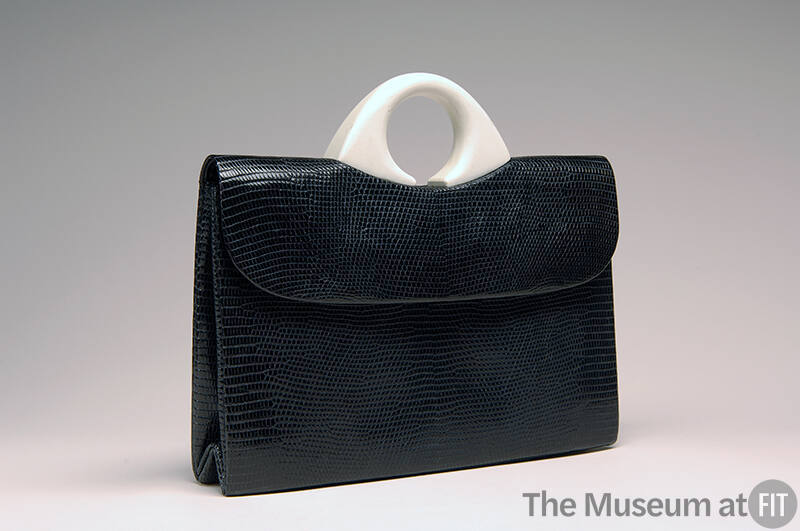 Black envelope, lizard skin bag with small round white plastic handle
