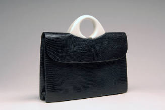 Black envelope, lizard skin bag with small round white plastic handle