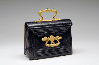 Small black lizard rectangular handbag with gold clasp ornament and top handle