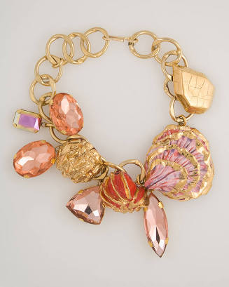 Gold chain choker necklace with orange gems and red and pink painted shells on white background