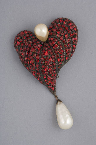 Large asymmetrical heart shaped brooch with red rhinestones and large baroque pearl at top and …