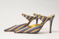 Alternate view of yellow, brown and violet striped mules side by side, showing tapered instep s…