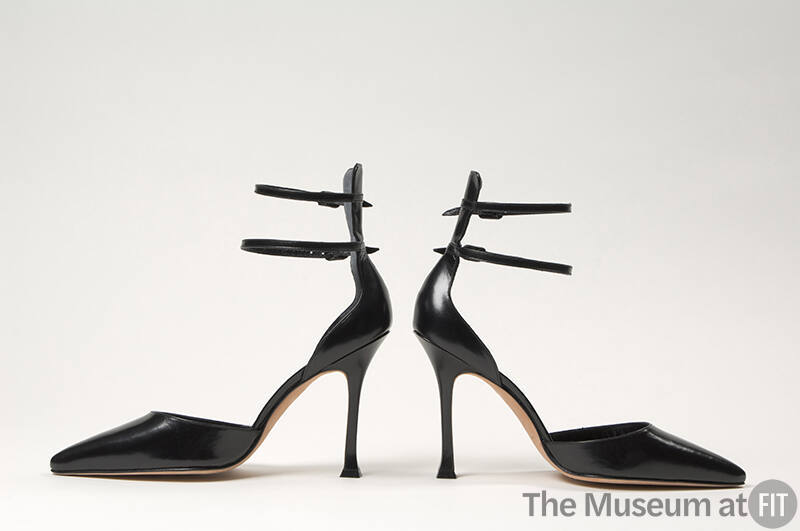 Pair of black d'Orsay shoes with double ankle straps attached to high counter, high stiletto he…