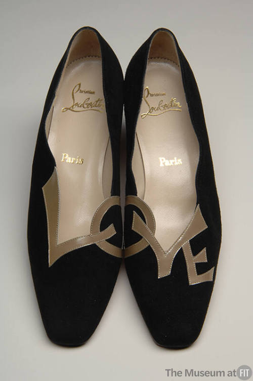 Black square toe shoes with the word LOVE appliqued in tan leather across both shoes 