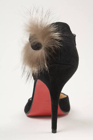 Black d'Orsay pumps with fur trim at ankle