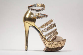 Metallic gold high heel sandal with mirrored platform sole, two wire ankle buckle straps and fo…