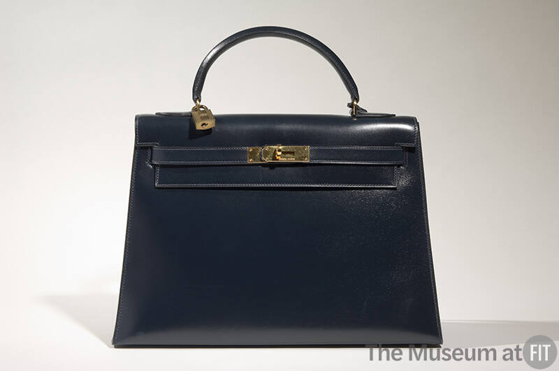 Navy Kelly bag with brass logo hardware and lock