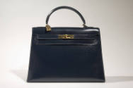 Navy Kelly bag with brass logo hardware and lock