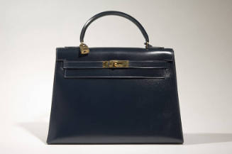 Navy Kelly bag with brass logo hardware and lock
