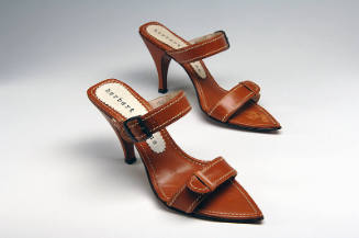 Pair of tan leather high heel sandals with white stitching, two straps and pointed toe