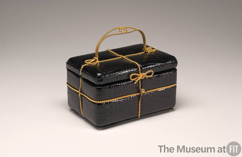 Shiny black parcel box pag with gold twisted wire trim and handle