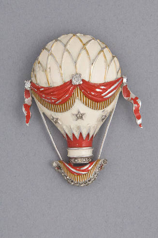 Brooch of white hot air balloon with red sash