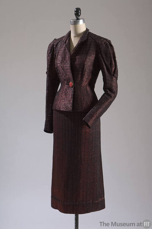 Black and red metallic striped single button jacket and matching skirt 