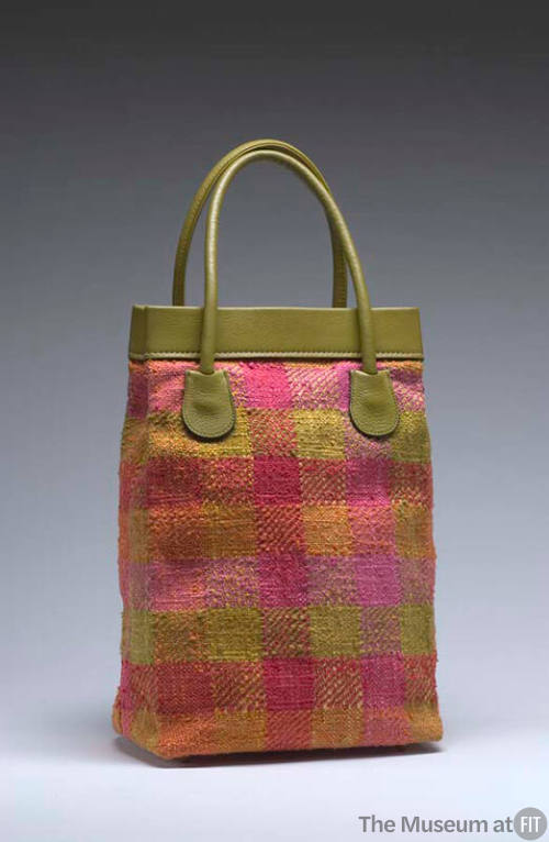 Red, orange, yellow and green plaid tote bag and green leather handles