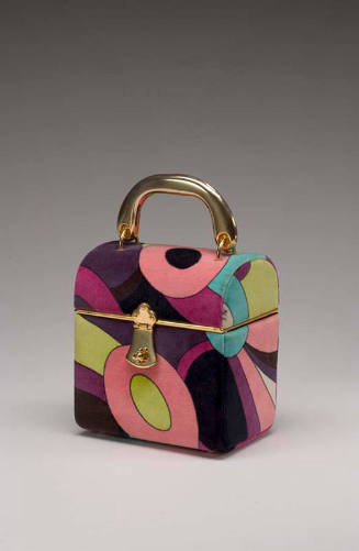 Box style velvet handbag with pink, blue, purple, green abstract design and gold handle 