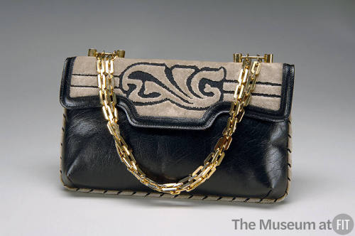 Navy blue envelope handbag with beige cut velvet decoration on flap and gold chain handle 