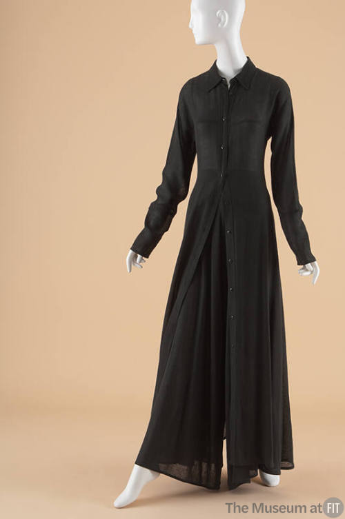 Black long fitted duster with black flared pants