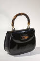 Black fold over handbag with bamboo clasp and handle 