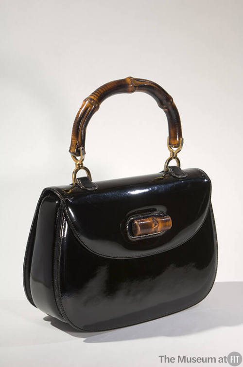 Black fold over handbag with bamboo clasp and handle 