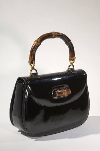 Black fold over handbag with bamboo clasp and handle 