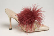 Off-white high heel mule with red and green berry brocade design and tuft of dark red feathers …