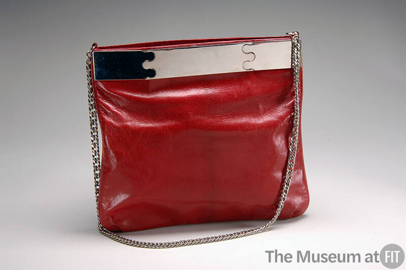 Red leather shoulder bag, square shaped pouch, with silver chain strap and silver top bar with …