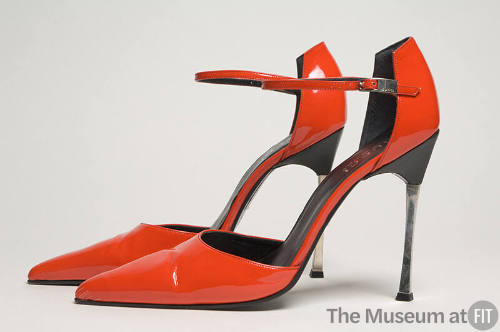 Red patent leather ankle strap sandals with high metal heels