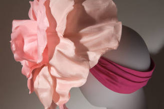 Oversize pink rose hat on pleated magenta band