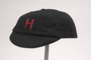 Black collegiate cap, red letter "H" embroidered, short bill 