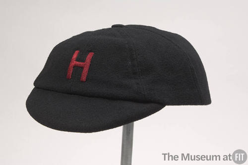 Black collegiate cap, red letter "H" embroidered, short bill 