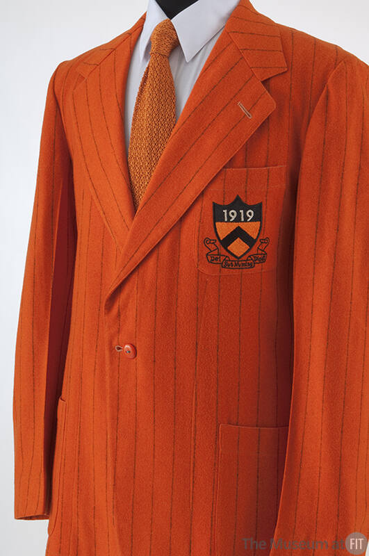 Man's orange Princeton jacket with black pin stripes; breast patch pocket with inisgnia patch: …