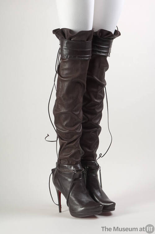 Brown thigh high boots with extreme high heels with attached belts