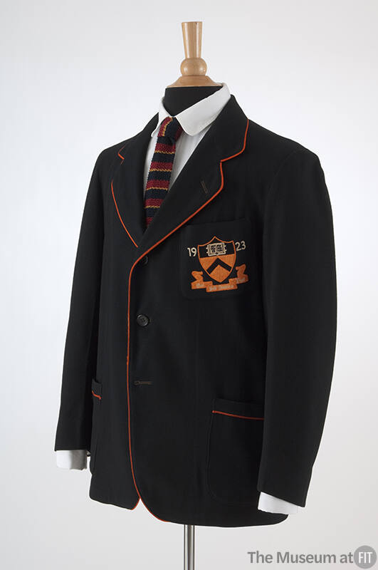 Man’s black blazer with orange trim, orange Princeton University insignia and 1923 embroidered …