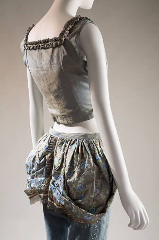 BAck view of blue and gold silk bustier with lace trim, matching floral bustle over beaded deni…