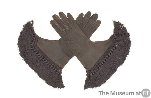 Pair of black gloves with braid and long tassel fringe at cuff