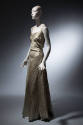 Light blue floor length evening dress with gold horizontal sawtooth stripes, asymmetrical bodic…