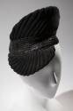 Black trapunto quilt stitched cocktail hat with pointed crown and visor