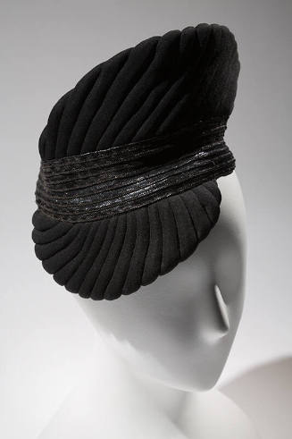 Black trapunto quilt stitched cocktail hat with pointed crown and visor