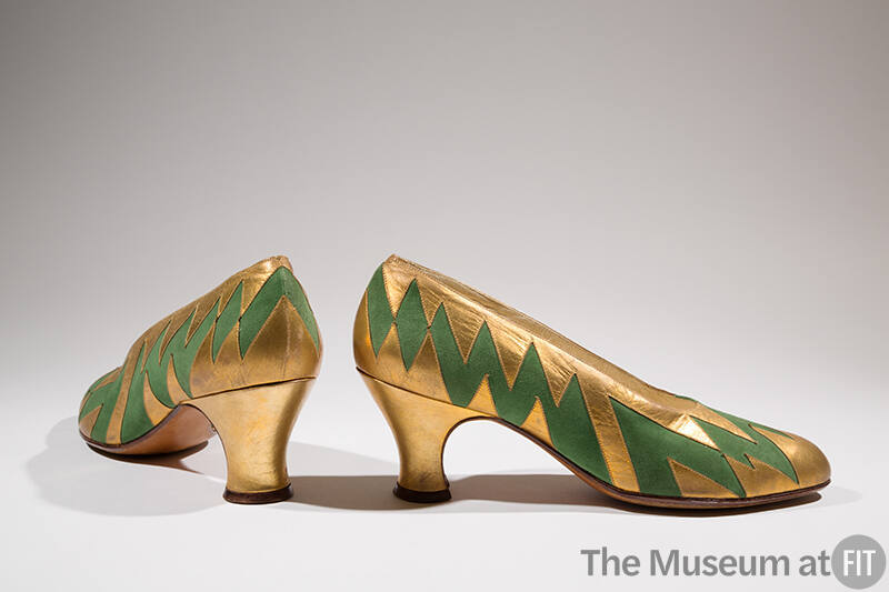Pair of gold pumps with green zigzag pattern and Louis heel